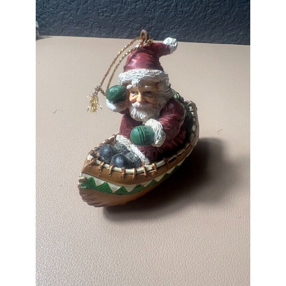 Vintage House of Llyod Christmas Around The World Santa In Canoe Figurine Decor